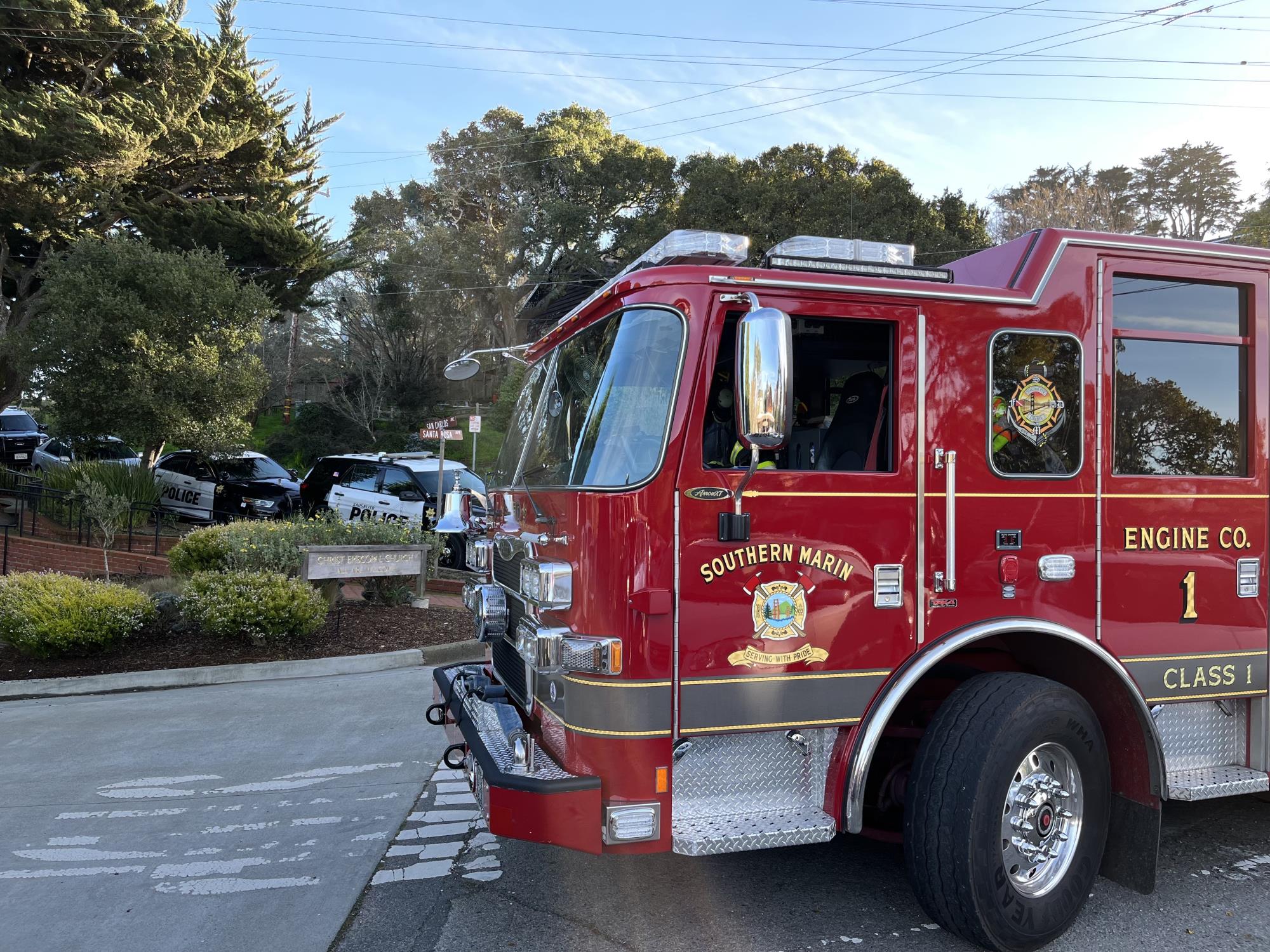 Southern Marin Fire District Engine 1 parked in front of police car.