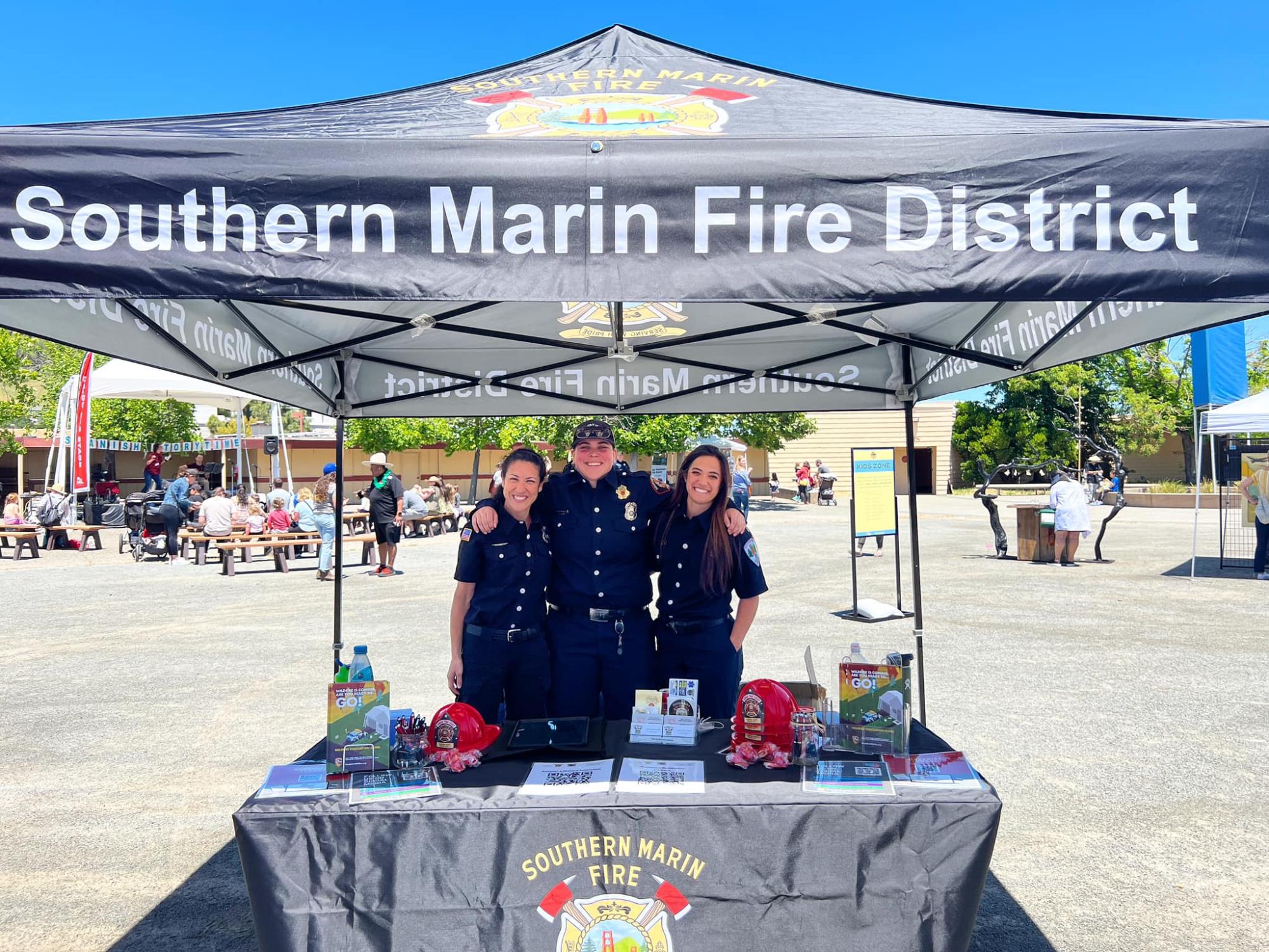 [ID: SMFD staff at Ember Stomp event image held May 20, 2023 at Marin Civic Center Fairgrounds]