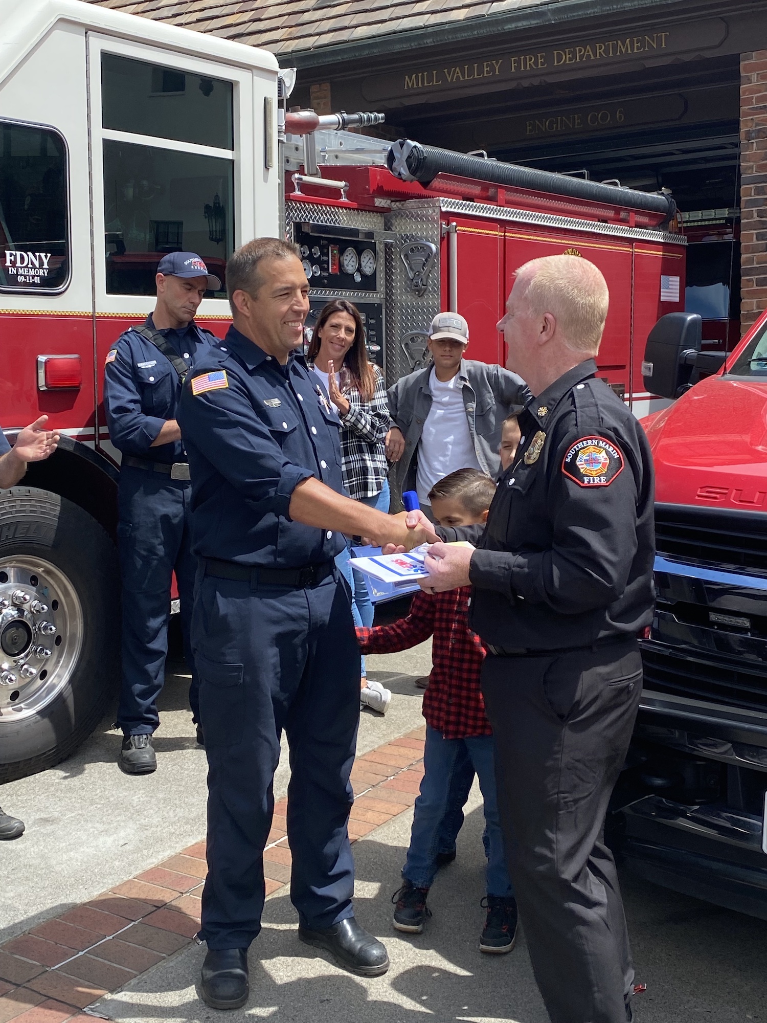 SMFD Engineer Paramedic Oreilly shaking hands with Fire Chief.